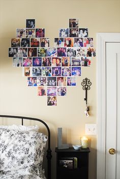 a bedroom with many pictures on the wall and a bed in front of a door