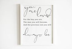 a black and white print with the words you are loved on it in cursive writing