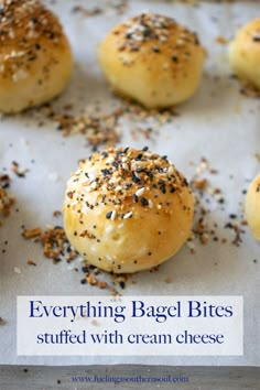 rolls with sesame seeds and sprinkles on a baking sheet, ready to be baked