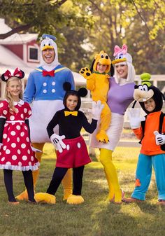 a group of people in mickey mouse costumes