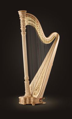 an ornate golden harp on a black background with the strings still attached to it's sides