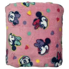 a pink blanket with mickey and minnie mouses on it, all in different colors