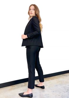 A pair of black maternity dress pants is the most important workwear item in a pregnant woman's office and event wardrobe. Our luxuriously stretchy, tailored cigarette over belly trousers are the absolute best dress pants for maternity if you want to keep your professional polish at the office while growing that adorable baby (or babies). They're petite and tall friendly, and offered in extended sizing. Our comfy over belly band provides room to grow during pregnancy and postpartum tummy support Tailored Black Dress Pants For Office, Fitted Trousers For Office Lady, Fitted Dress Pants For Office, Fitted Trousers Dress Pants For Office Lady, Black Stretch Dress Pants For Office, Black Stretch Dress Pants For Work, Fitted Black Pantsuit For Office, Versatile Stretch Formal Pants, Black Fitted Pantsuit For Office