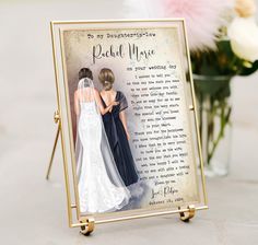 an image of a wedding card with two brides on it and flowers in the background