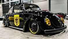 a black and yellow car parked in a garage