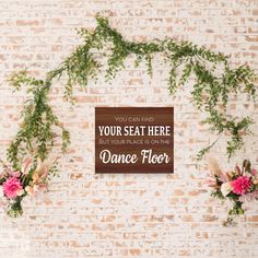 there is a sign that says your seat here but your place is on the dance floor