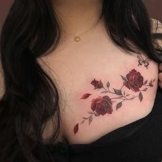 a woman with a rose tattoo on her chest