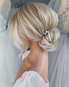 a woman with blonde hair in a wedding dress