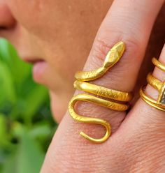 This is a thick, solid, and heavy 24k gold snake ring. Each one is individually hand-made by me, no two are identical. The Snake wraps around the finger twice, and it's body is around 3mm wide. I have seen some really ancient versions of this ring, that is what inspired me to make this rendition. Thanks for checking this ring out! Please look at my customer reviews, I try really hard to please. Unique Hand Forged Snake Ring As Gift, Unique Hand Forged Snake Ring, Gold Snake Ring Gift, Yellow Gold Snake Ring For Wedding, Snake-shaped Yellow Gold Wedding Ring, Adjustable Gold Snake Ring Symbolic, Adjustable Gold Symbolic Snake Ring, Unique Yellow Gold Snake Ring, Unique Yellow Gold Snake-shaped Ring