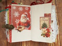 an open christmas card with santa clause on it