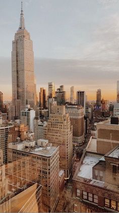 an aerial view of the city with tall buildings and skyscrapers in the foreground