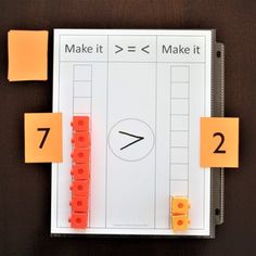 an activity book with orange sticky notes attached to it and numbers cut out on the page