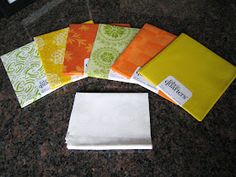 five different colored napkins sitting on top of a counter