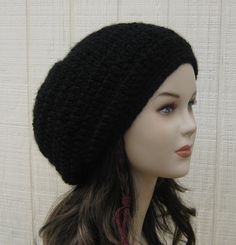 a mannequin head wearing a black knitted hat