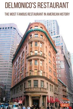 people are crossing the street in front of an old building on a busy city street