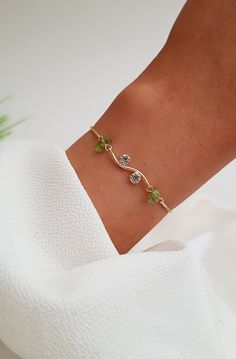 Raw Peridot Bracelet, Gold Peridot Bracelet, Peridot Crystal Jewelry, August Birthstone Jewelry, Peridot Healing Jewelry, Birthday Gifts, August Birthday Gifts, Friendship Gift, Gift For Her    This is a delicate natural raw Peridot bracelet with an 18K gold adjustable chain. All of our jewelry is handmade and every stone is handpicked for the best quality. the color and size of each stone are natural, unique, and individual. Our Elegant Green peridot bracelet is great for a bridesmaid gift, Bir Peridot Jewelry Aesthetic, August Jewelry, Raw Peridot, Peridot Bracelet, Peridot Crystal, August Birthday, Raw Crystal Jewelry, Peridot Jewelry, August Birthstone Jewelry