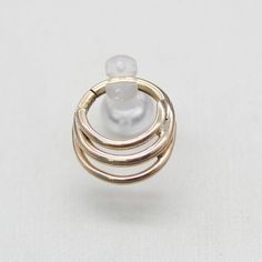 an image of three rings on top of each other in gold and white marbles