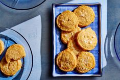 some cookies are sitting on a blue plate