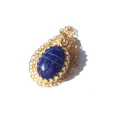 "Luxurious lapis lazuli scarab pendant necklace is a great gift for the self, or a loved one. This deep blue semi precious stone was hand cut and mounted in a gold filled crown bezel, then strung on a cable chain with spring clasp.  Scarabs are considered to signify new beginnings and good luck. Pendant is 23mm by 14.5mm. Chain is 18\" long. We gift box all our jewelry.  Need your gift wrapped and a short note?  Leave a message to Carol at checkout for this complimentary service. International s Scarab Pendant, Gulfport Ms, Short Note, Scarab Bracelet, Lapis Jewelry, Lapis Lazuli Pendant, Carnelian Pendant, Gold Statement Ring, Gold Nugget