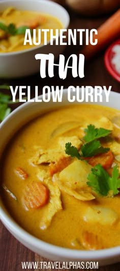 two bowls filled with yellow curry next to carrots and celery on a wooden table