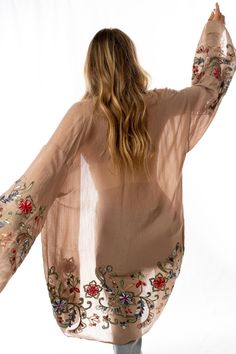 Nothing is more fun than a kimono covered in floral! This perfect layering piece features a sheer fabric in a longline silhouette with accents of crochet florals in multicolors along the hem and wide sleeves.Model is 5'4" and wearing a one size.100% Polyester Hand wash cold, Lay flat to dry. OS sizing fits most* sizes US 0-18Length: 38 inBust Across: 25 inSleeve Length: 17 inSleeve Opening: 11 in Import Kimono And Jeans, Ceremonial Clothing, Slouch Beanie, Beautiful Kimonos, Print Kimonos, Sheer Fabric, Bohemian Clothes, Wide Sleeves, Sheer Fabrics