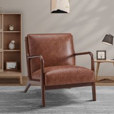 a brown leather chair sitting on top of a rug