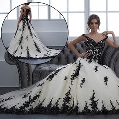 a woman in a black and white wedding dress sitting on a couch with her hands on her hips