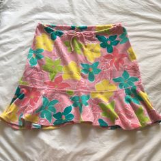 Never Worn Terry Cloth Lilly Pulitzer Floral Skirt, Size S. This Skirt Features Classic Lilly Colors And Floral Print -- Perfect For Vacation! With A Very Pretty Floral Pattern, This Skirt Includes An Adjustable Drawstring At The Waist And A Flounce At The Hemline. Never Worn, In Like New Condition Summer Floral Print Pink Mini Skirt, Summer Pink Floral Print Mini Skirt, Pink Floral Print Summer Mini Skirt, Casual Fitted Pink Swim Skirt, Pink Stretch Lined Swim Skirt, Casual Multicolor Swim Skirt For Spring, Casual Pink Stretch Swim Skirt, Cute Pink Flared Skirt, Pink Floral Print Mini Skort