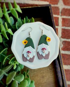 These sweet little gnomes are busy picking mushrooms.  All details are crafted from pigmented polymer clay; nothing is painted.   Hanging from stainless steel hooks, these are the perfect statement earrings for fall! Sterling Silver hooks available on request for sensitive ears. Check out my shop for more unique items!  All orders over $35 ship for free! Gnome Clay, Picking Mushrooms, Clay Gnomes, Gnome Earrings, Growing Garden, Mushroom Growing, Earrings Clay, Garden Gnome, Air Dry Clay