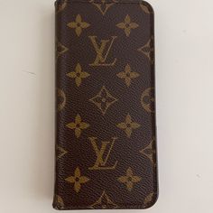 Authentic Louis Vuitton Folding Phone Case. Receipts / Tag Authentication Owned And Used By One Person, Myself Purchased In Portland Oregon Store. Very Small, Normal Wear To The Back Edge Where Is Folds. I Never Would Fold Around The Cover To The Back Saving The Edges. I Adore This Cover. It’s Not Made Any Longer. I Upgraded To Iphone 12 And This Will Not Fit Or I Would Not Be Selling. Hope Someone Finds A Good Home For Her. She Is Beautiful In Person And Protective. Get Lots Of Compliments Louis Vuitton Accessories, Portland Oregon, Iphone X, Authentic Louis Vuitton, Iphone 12, Portland, Oregon, Phone Case, Louis Vuitton