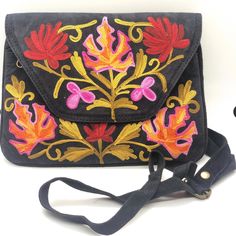 "Beautiful Floral Embroidered Shoulder Bag perfect for every occasion.  Create a wow moment by uplifting any plain outfit with a splash of color.  Makes great gifts-Birthdays, Anniversaries etc. STYLE: FBM-KVE-250 BN836-120519 Features: Style: Flower Embroidered Shoulder Bag Strap: 1\" Adjustable Size: 9\" x 6\"  Pockets: 3  Closure: Main pocket with zip closure. Loose change pocket inside the main compartment with zipper closure. Another Pocket with Zipper Closure Material: Imported Suede Leath Casual Black Embroidered Bag, Casual Floral Embroidery Shoulder Bag For Travel, Black Bags With Floral Embroidery For Spring, Casual Shoulder Bag With Floral Embroidery For Travel, Casual Travel Shoulder Bag With Floral Embroidery, Floral Embroidery Travel Shoulder Bag, Travel Shoulder Bag With Floral Embroidery, Traditional Bags With Floral Embroidery For Spring, Traditional Black Shoulder Bag With Floral Embroidery