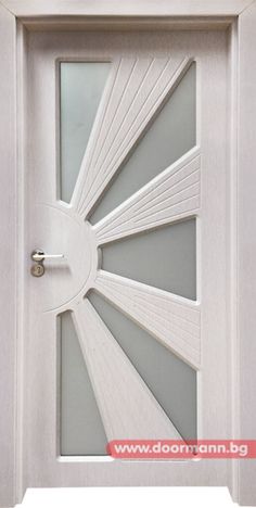 a white door with a glass window and metal handle on the top half of it