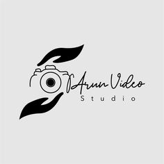 the logo for an art studio with a camera in it's hand and leaves