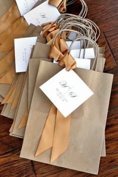 some brown paper bags with tags on them