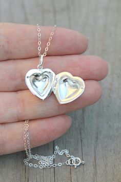 925 sterling silver Puff Heart Locket on a delicate, shimmering silver chain. Insert your own photos or keepsakes. Please select length from the drop down menu. C O M P O N E N T S: Chain - 925 sterling silver (including rings and clasp) Locket - 925 sterling silver, 17.2x18.5mm, double sided with hinge Your item will arrive in a pretty embossed jewelry box - Ready for gift Giving! Mother's Day White Gold Locket Necklace, Mother's Day Keepsake Locket Charm Necklace, Personalized Silver Locket Necklace For Mother's Day, Personalized Silver Locket Necklace For Mom, Silver Locket Jewelry For Mother's Day, Open Heart Locket Necklace For Anniversary Gift, Open Heart Locket Necklace For Anniversary, White Gold Locket Necklace For Valentine's Day Gift, Mother's Day Silver Locket Jewelry