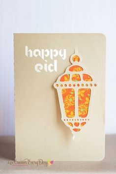 a card with an orange and yellow lantern on it's side, in front of a white background