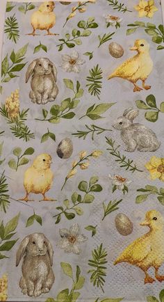 a table cloth with rabbits and chicks on it