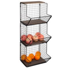 three tiered wire basket with apples and oranges on the bottom, one is black