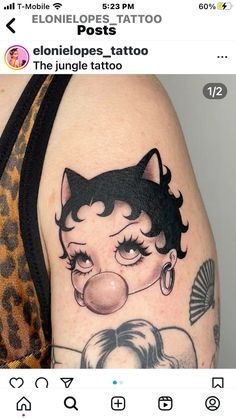 an image of a woman with a cat tattoo on her arm and the caption reads,