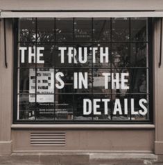 the truth is in the details written on the glass door of a store front window