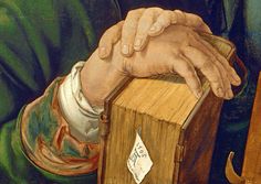 a painting of a man's hand on top of a wooden box with a note stuck to it