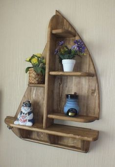 a wooden shelf that has some flowers on it