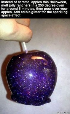 an apple with purple speckles on it is being held up by a hand