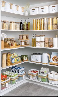 an organized pantry with lots of food items and containers on the shelve shelves