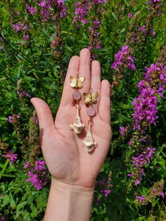 Fox Vertebrae and Pink Chalcedony Gold Butterfly Earrings ✨️ Featuring fox vertebrae that dangle from Pink Chalcedony bezels and brass butterfly connectors. The hooks are gold plated They hang 2.75  inches  All bones utilized in our pieces are ethically sourced and cruelty free  Made with nickel free materials Gold Butterfly Earrings, Brass Butterfly, Fairy Cosplay, Forest Witch, Butterfly Earrings Gold, Pink Chalcedony, Cottagecore Fairy, Bone Jewelry, Gold Butterfly