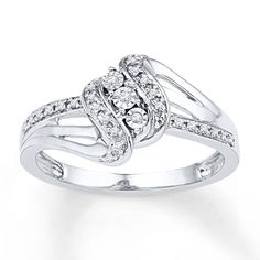 a white gold ring with diamonds on it