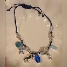 Under The Sea Treasures Bracelet, Adjustable Closure, Charms With Blue Cord, New In Box, Clean And Smoke Free Home Avon Jewelry, Box Color, Under The Sea, Womens Jewelry Bracelets, Blue And Silver, The Sea, Color Blue, Charms, Women Jewelry