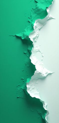 green and white wall with peeling paint on the bottom half, showing cracks in it