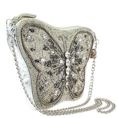 Mary Frances Flitter & Gleam Crossbody Butterfly Handbag Beaded Silver Bag New Flutter away in style with this butterfly-inspired silver beaded crossbody handbag. This trendy bag features glass and smokey grey rhinestones for a whimsical feel and a detachable silver chain shoulder strap so you can unfold your wings and go out in elegance. 11 x 1 x 7" Strap Length End to End: 49" Strap Drop: 23.5" Removable crossbody chain strap, zipper closure, inside pocket, back pocket, fits a cell phone, genu Silver Crossbody Evening Bag, Gray Crossbody Evening Bag, Gray Crossbody Bag For Evening, Formal Silver Embellished Shoulder Bag, Silver Crossbody Shoulder Bag, Glamorous Silver Embellished Shoulder Bag, Gray Evening Shoulder Bag, Luxury Silver Beaded Bag, Luxury Silver Beaded Evening Bag