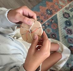 a child is playing with a piece of wood that has been stitched onto it